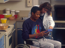A nurse helping a man who is in a wheelchair A nurse helping a man who is in a wheelchair